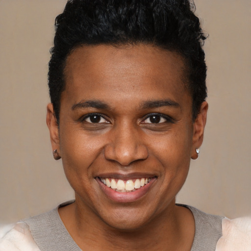 Joyful black young-adult male with short  black hair and brown eyes