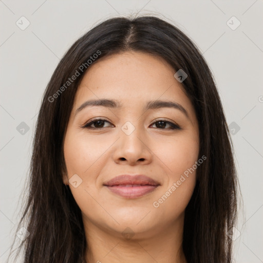 Joyful latino young-adult female with long  brown hair and brown eyes