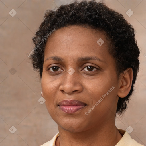 Joyful black adult female with short  brown hair and brown eyes