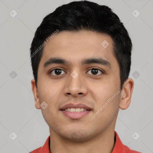 Joyful latino young-adult male with short  black hair and brown eyes