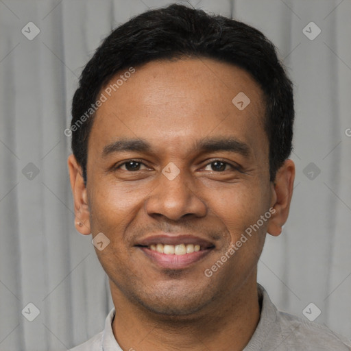 Joyful latino young-adult male with short  black hair and brown eyes