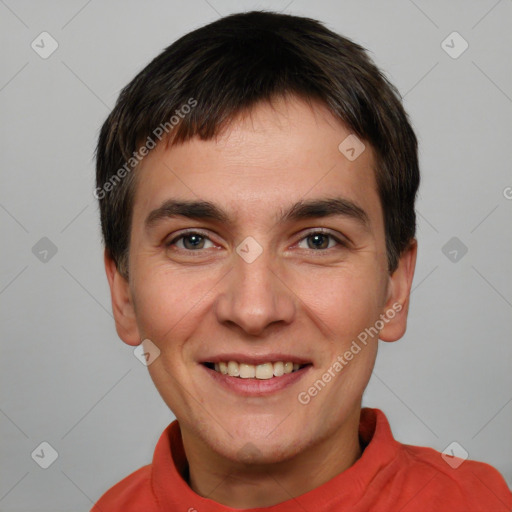 Joyful white young-adult male with short  brown hair and brown eyes