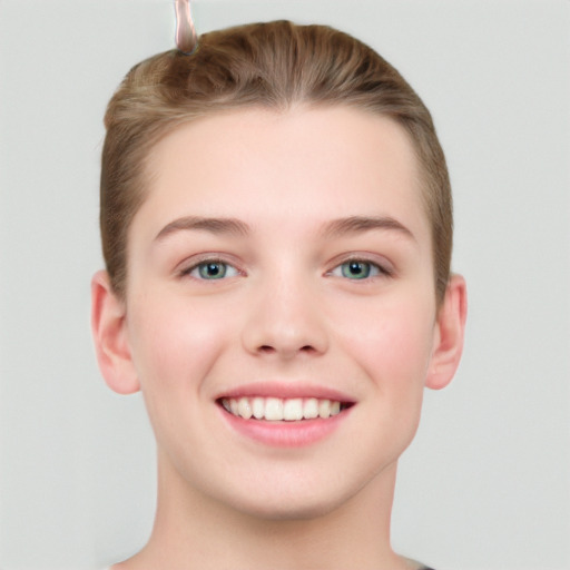 Joyful white young-adult female with short  brown hair and grey eyes