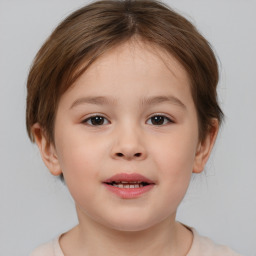 Joyful white child female with medium  brown hair and brown eyes