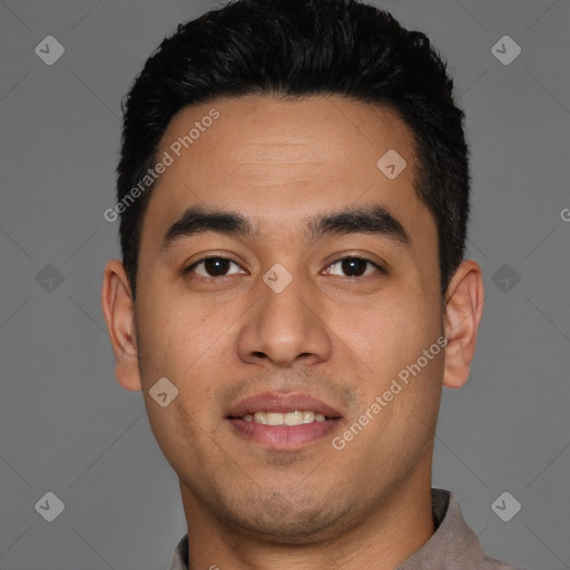 Joyful white young-adult male with short  black hair and brown eyes