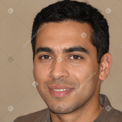 Joyful latino young-adult male with short  black hair and brown eyes