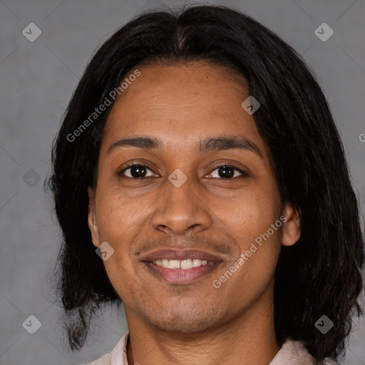 Joyful black adult female with medium  black hair and brown eyes