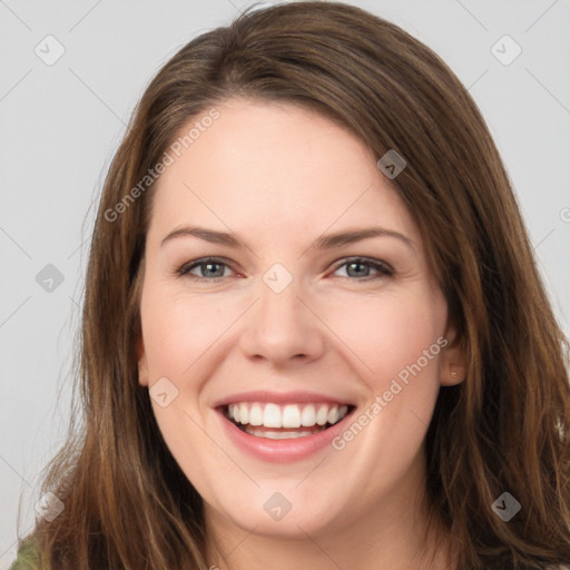 Joyful white young-adult female with long  brown hair and green eyes