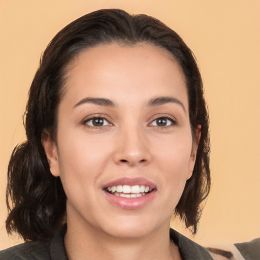 Joyful white young-adult female with medium  black hair and brown eyes