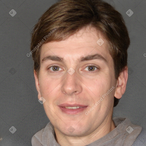 Joyful white adult male with short  brown hair and grey eyes