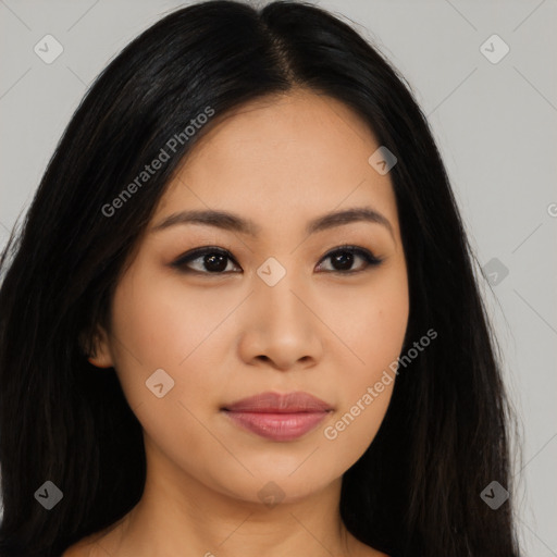 Joyful latino young-adult female with long  black hair and brown eyes