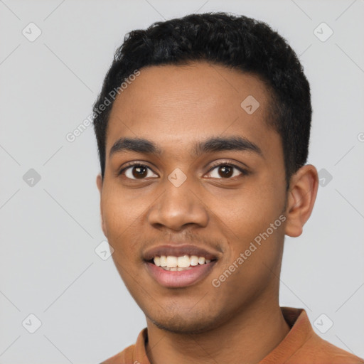 Joyful latino young-adult male with short  black hair and brown eyes