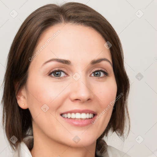 Joyful white young-adult female with medium  brown hair and green eyes