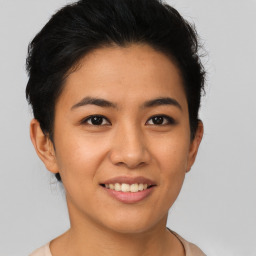 Joyful asian young-adult female with short  brown hair and brown eyes