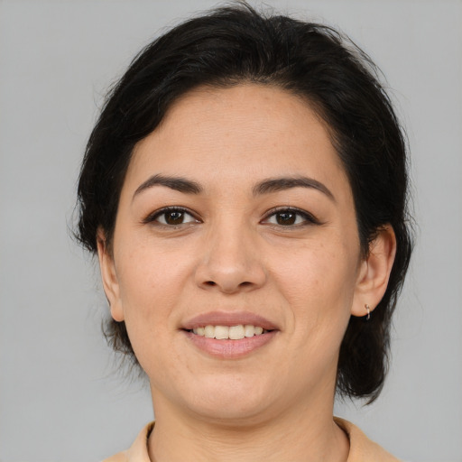 Joyful white adult female with medium  brown hair and brown eyes