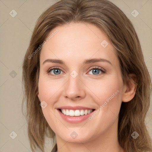 Joyful white young-adult female with medium  brown hair and green eyes