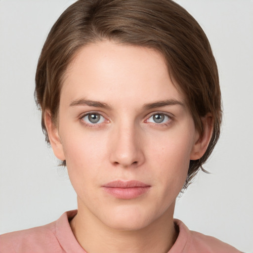 Neutral white young-adult female with medium  brown hair and grey eyes