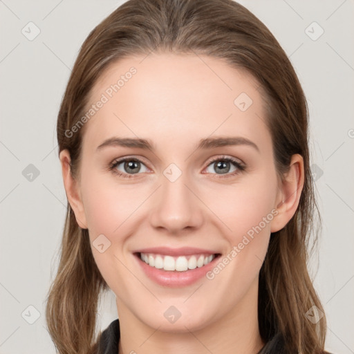 Joyful white young-adult female with long  brown hair and grey eyes