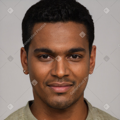 Joyful black young-adult male with short  black hair and brown eyes