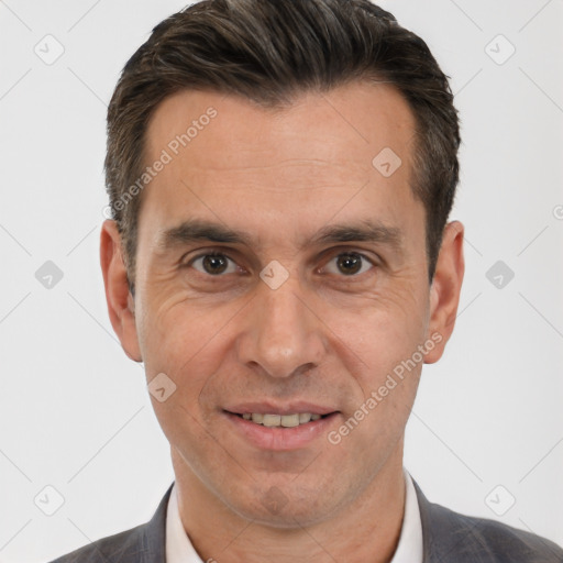 Joyful white adult male with short  brown hair and brown eyes