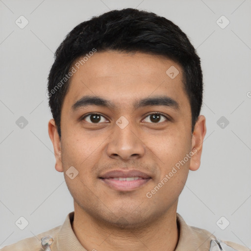 Joyful latino young-adult male with short  black hair and brown eyes