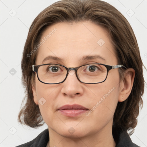 Joyful white adult female with medium  brown hair and grey eyes