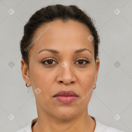 Joyful black adult female with short  brown hair and brown eyes