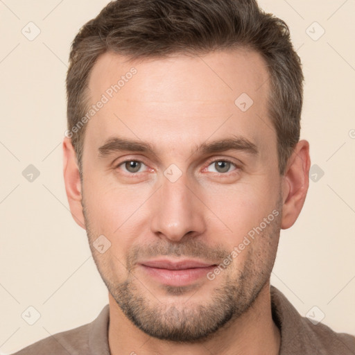 Joyful white young-adult male with short  brown hair and brown eyes