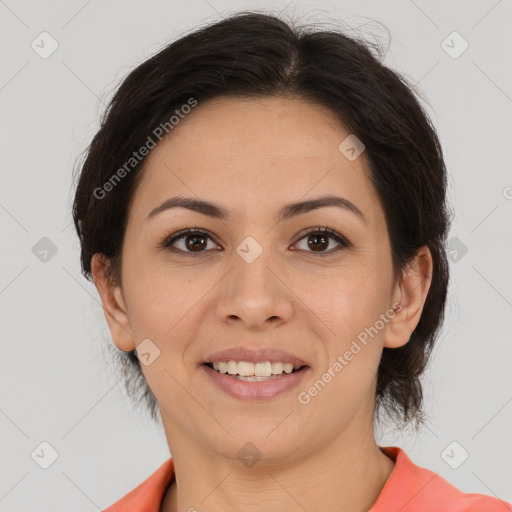 Joyful latino young-adult female with medium  brown hair and brown eyes