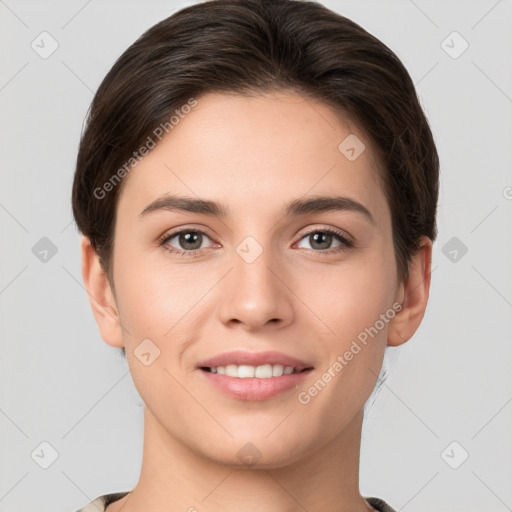 Joyful white young-adult female with short  brown hair and brown eyes