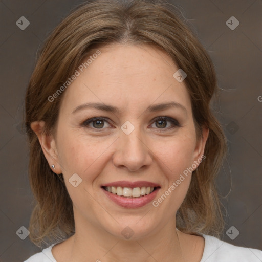 Joyful white adult female with medium  brown hair and brown eyes