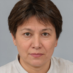 Joyful white adult female with short  brown hair and brown eyes