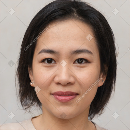 Joyful asian young-adult female with medium  brown hair and brown eyes