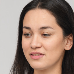 Joyful asian young-adult female with long  brown hair and brown eyes