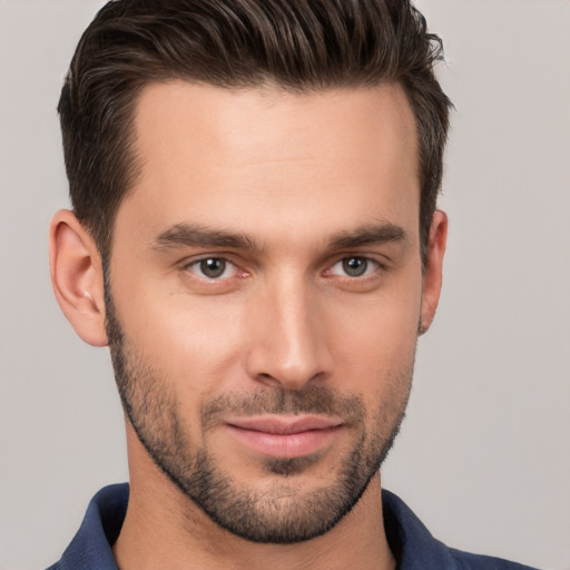 Joyful white young-adult male with short  brown hair and brown eyes