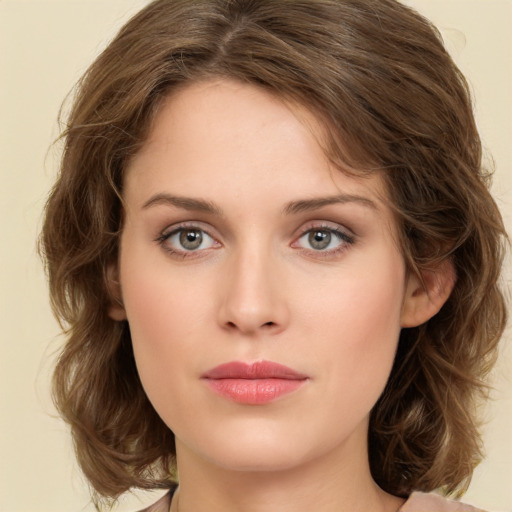 Neutral white young-adult female with medium  brown hair and green eyes