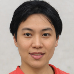 Joyful asian young-adult female with short  black hair and brown eyes