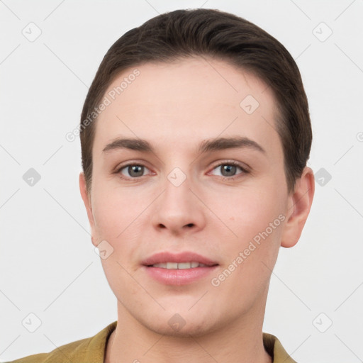 Joyful white young-adult female with short  brown hair and grey eyes