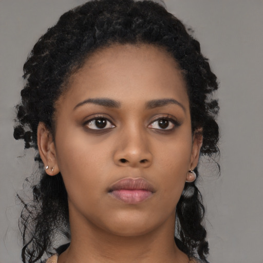 Neutral black young-adult female with long  black hair and brown eyes