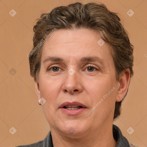 Joyful white adult male with medium  brown hair and brown eyes