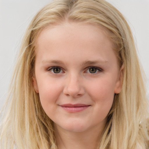 Joyful white child female with long  brown hair and blue eyes