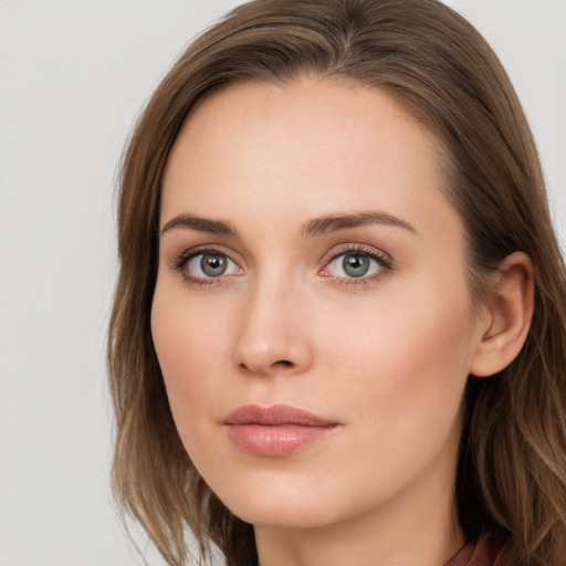 Neutral white young-adult female with long  brown hair and blue eyes