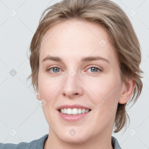 Joyful white young-adult female with medium  brown hair and blue eyes