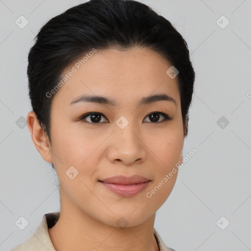 Joyful asian young-adult female with short  black hair and brown eyes