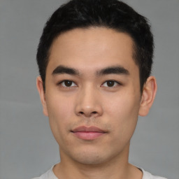 Neutral asian young-adult male with short  black hair and brown eyes