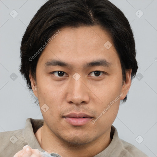 Neutral asian young-adult male with short  brown hair and brown eyes