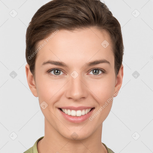 Joyful white young-adult female with short  brown hair and grey eyes