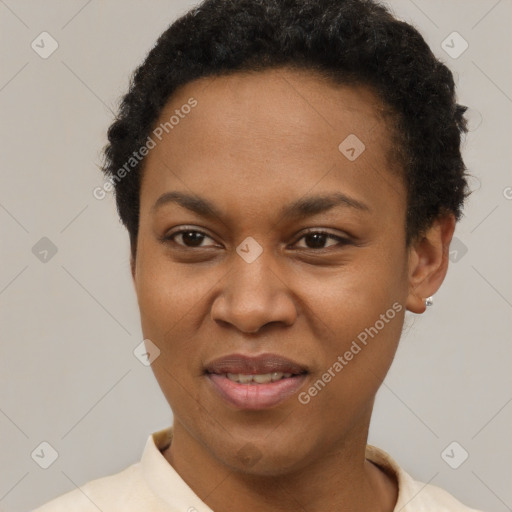 Joyful black young-adult female with short  brown hair and brown eyes