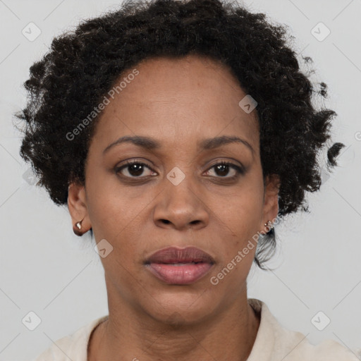 Joyful black adult female with short  brown hair and brown eyes