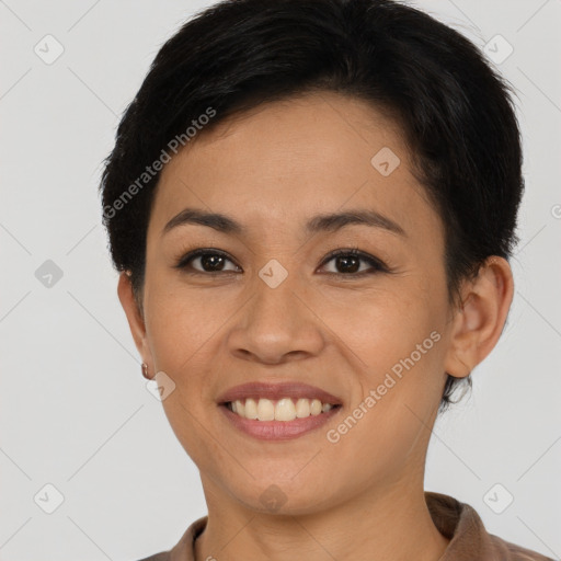 Joyful asian young-adult female with short  brown hair and brown eyes